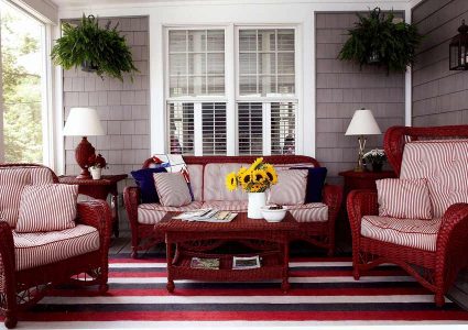 red wicker furniture on a porch